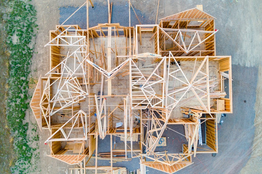 Overhead photograph of timber walls and roof framing during house construction
